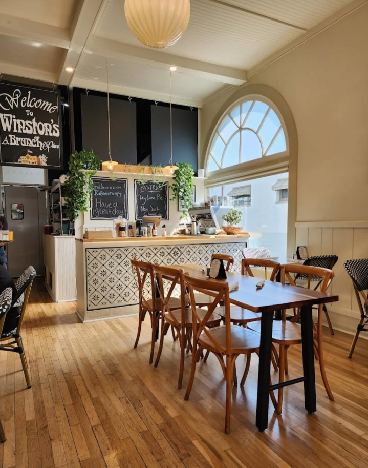 The sunlit interior of Winston's beneath its historic arched window