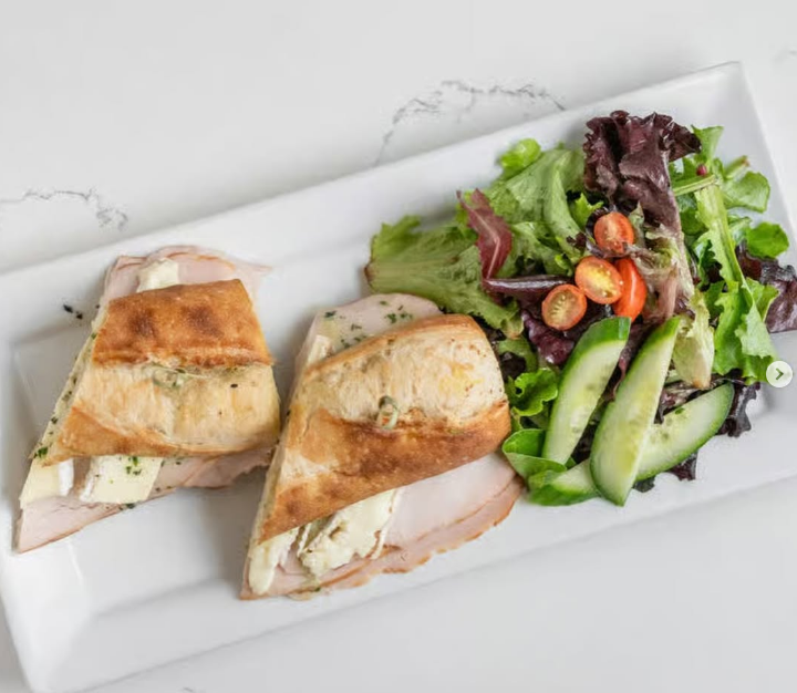 Turkey and brie baguette with a side salad